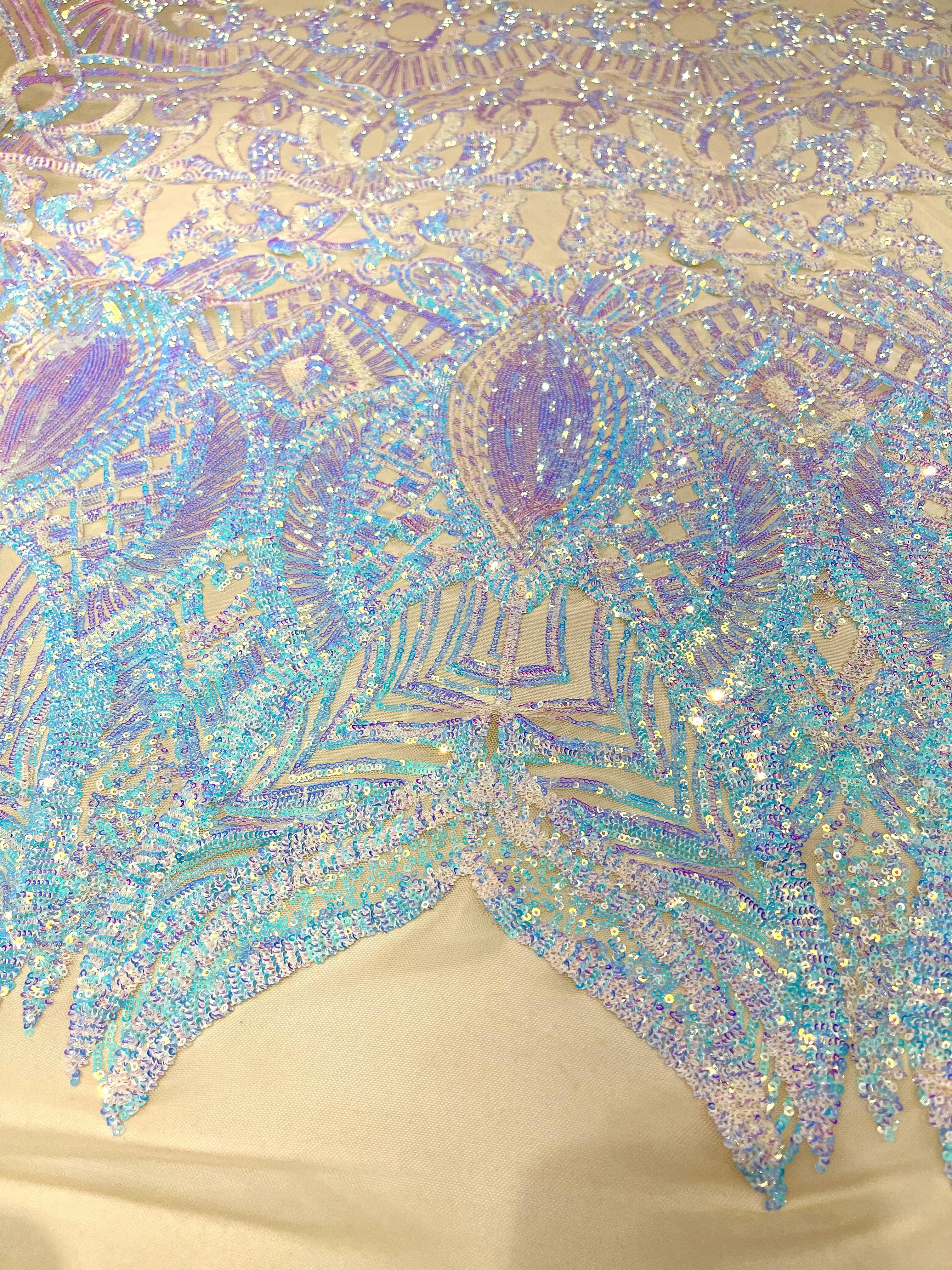Aqua Clear iridescent royalty design on a champagne 4 way stretch mesh-prom-sold by the yard.