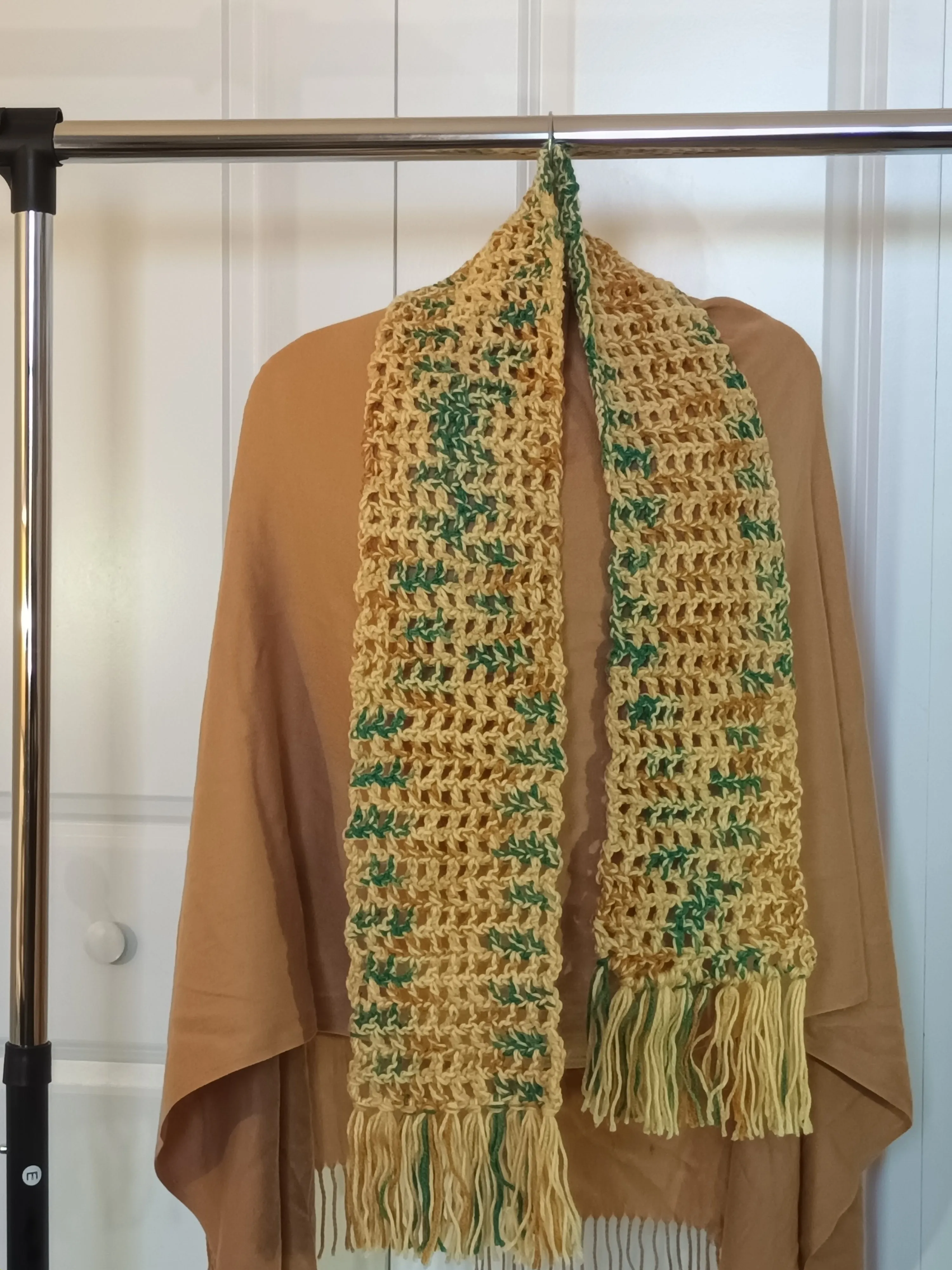 Gold multi colored scarf with fringe.