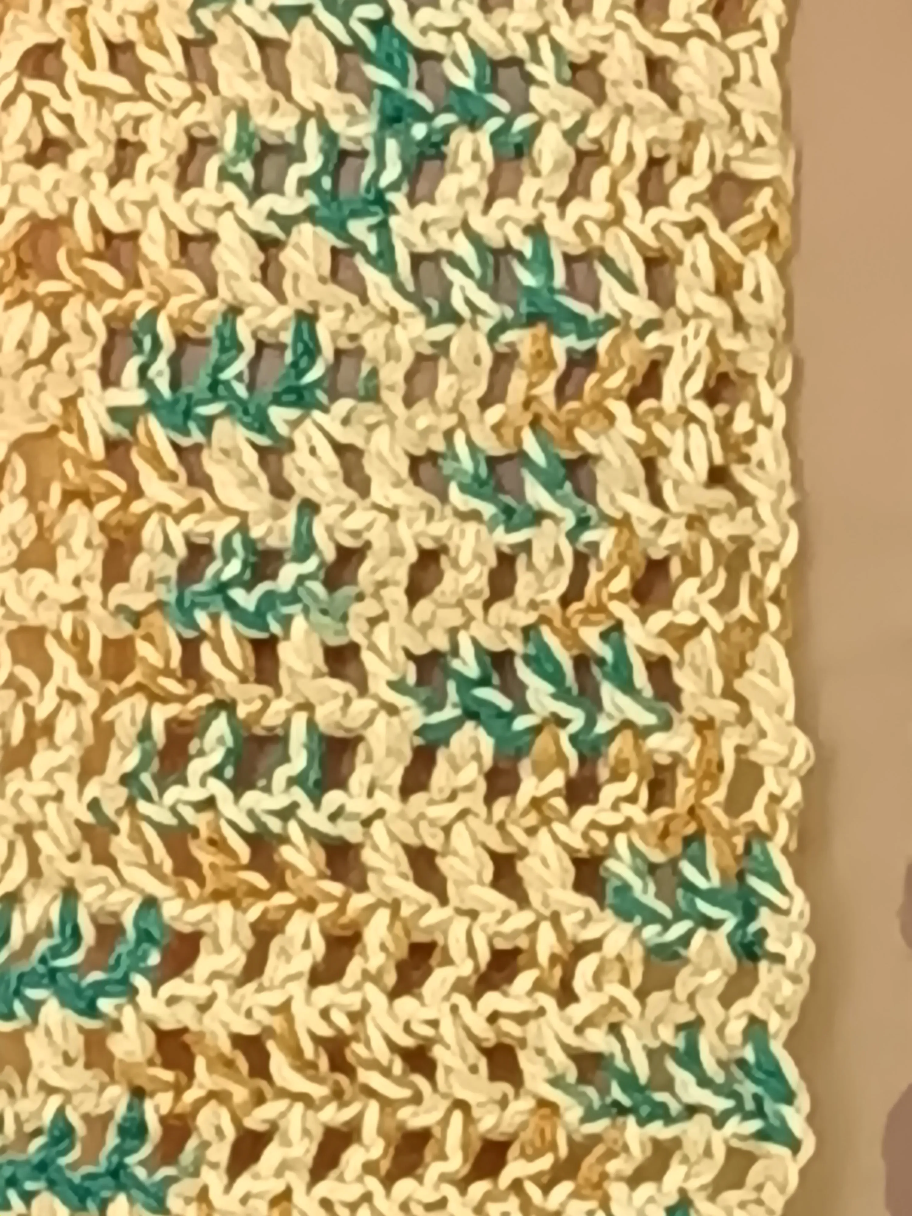 Gold multi colored scarf with fringe.