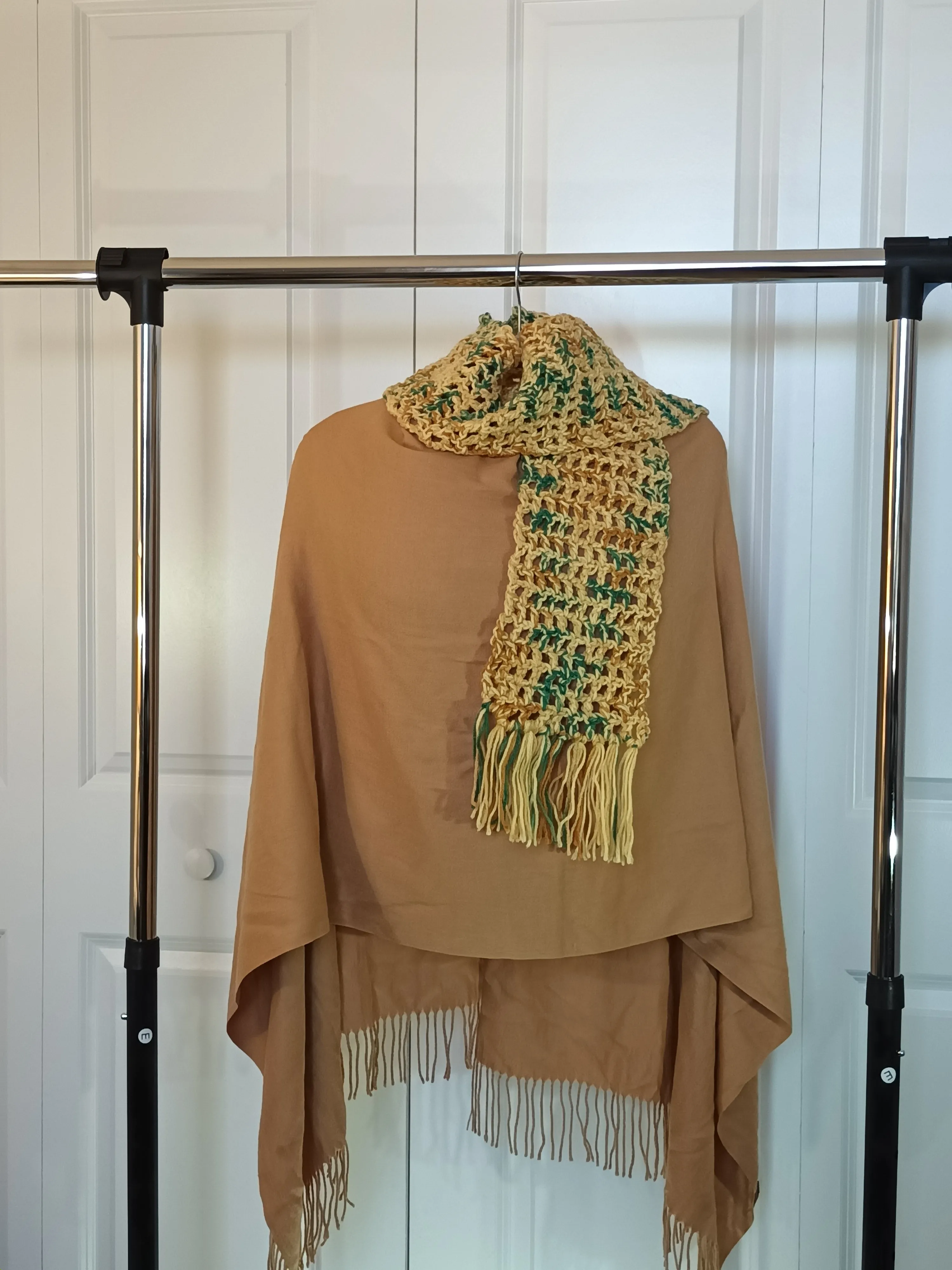 Gold multi colored scarf with fringe.