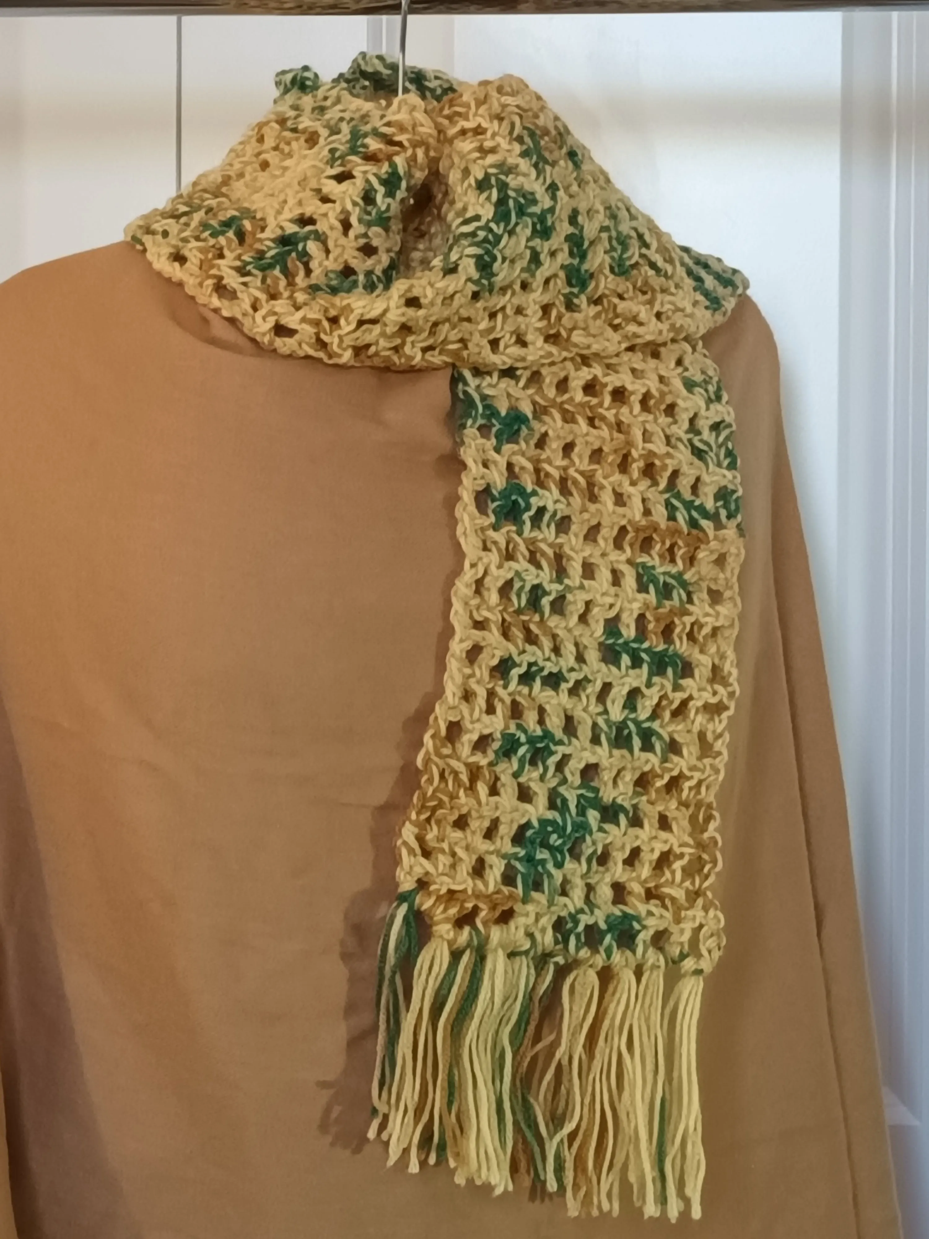 Gold multi colored scarf with fringe.