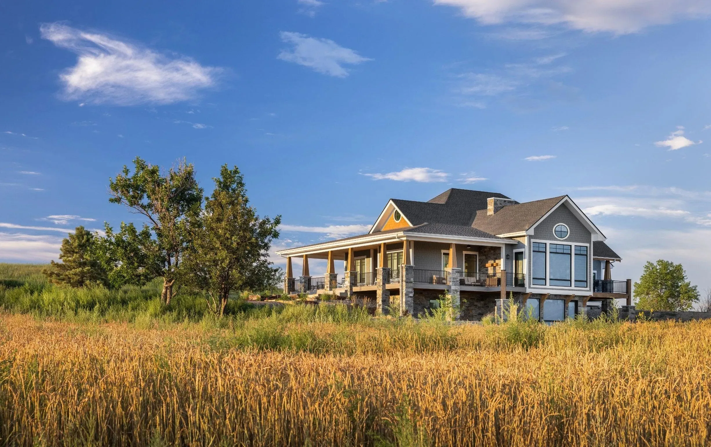 Spacious 4-Bedroom Home Plan with Walkout Basement and Expansive Porches