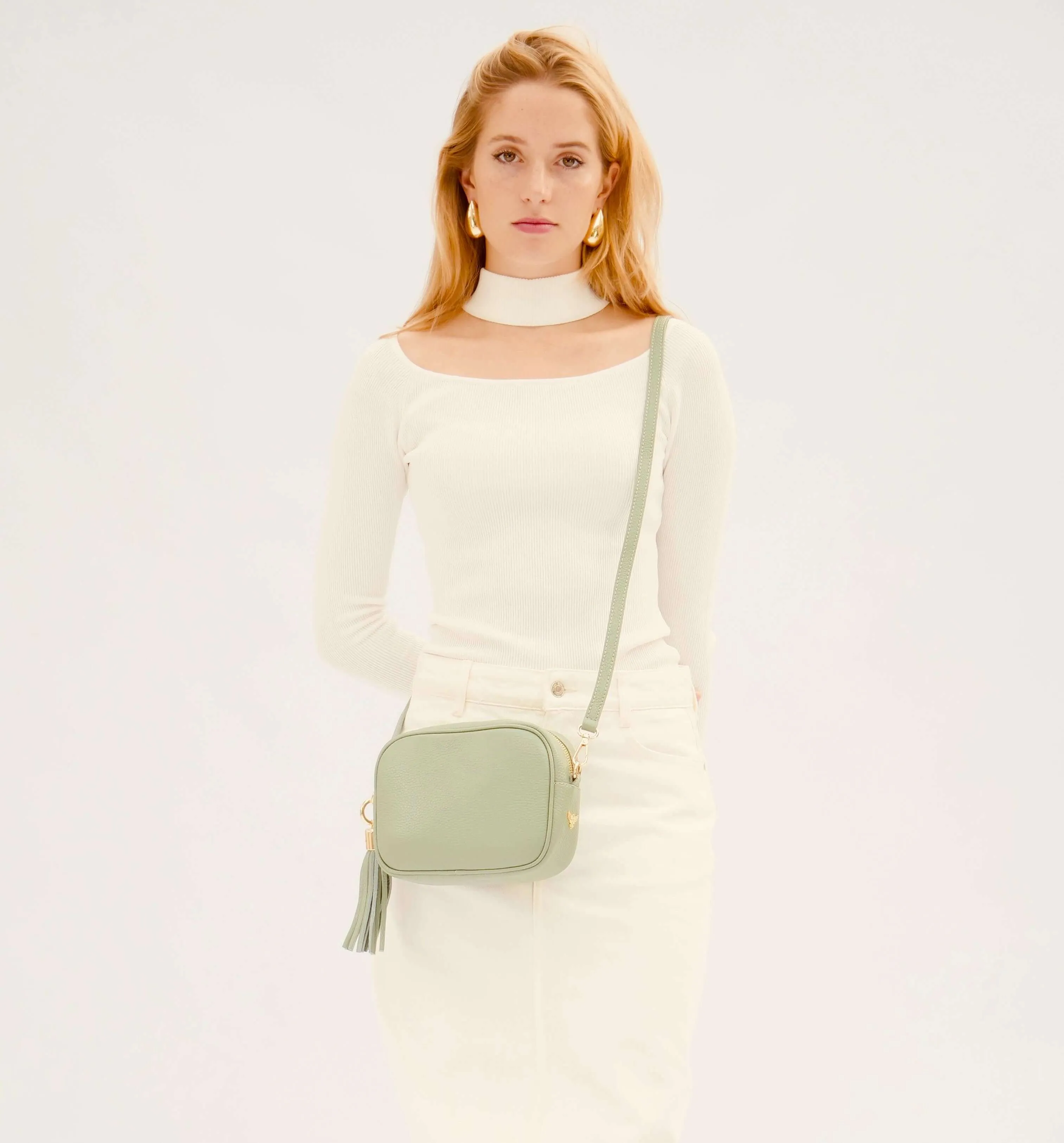 The Tassel Pistachio Leather Crossbody Bag With Orange & Gold Stripe Camo Strap