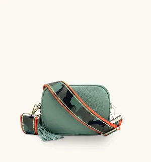 The Tassel Pistachio Leather Crossbody Bag With Orange & Gold Stripe Camo Strap